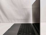 a laptop computer that is sitting on a white surface