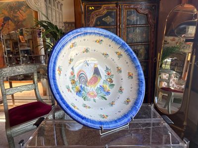 a blue and white plate sitting on top of a glass table