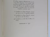 an open book with a handwritten poem on it sitting on a table