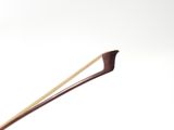 someone is holding a pair of chopsticks in their hand