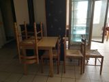 a table and chairs in a room with a sliding glass door