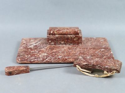 a piece of meat on a cutting board with a knife