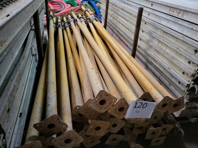 a lot of wooden baseball bats on display in a store