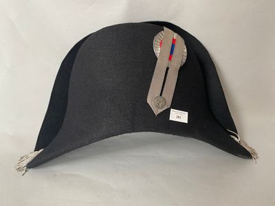 a black hat with a red and blue ribbon on it