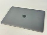 an apple macbook pro laptop sitting on top of a white table