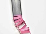 a knife that has been cut into pieces of pink paper