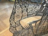 a statue of a skeleton sitting on top of a table