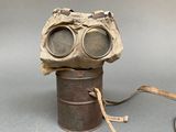 an old gas can with a pair of goggles on it