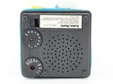 a small radio that is sitting on a white surface