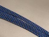 a close up of a blue neck tie on a white surface