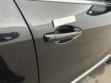 a sticker on the door handle of a car