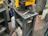 a machine that is sitting on a table in a garage