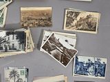 many old photos of people and animals on the wall