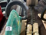 a picture of a chainsaw and other tools on a table