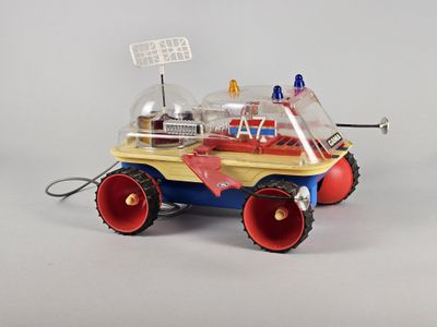 a toy car that has a radio on top of it