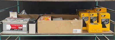 many boxes and boxes on a shelf in a room