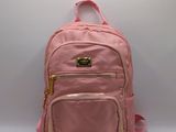 a pink backpack sitting on top of a white table