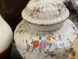 many vases that are sitting on a table