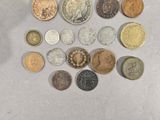 a lot of coins that are on the table
