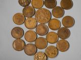 a lot of coins that are laying on the table