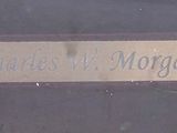 a close up of a name plate on a door