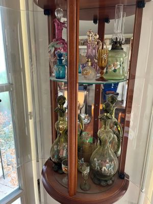 many glass vases on display in a curiole