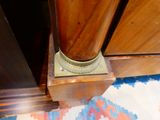 a close up of a wooden cabinet with a door handle