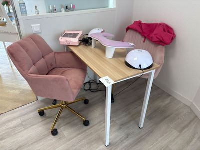 a desk with a chair and a computer on it