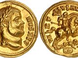 a gold coin with an image of a man on a horse