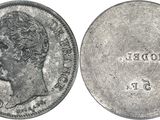 a close up of a coin with a woman ' s face on it