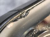 a close up of a metal object with a hole in it