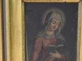 painting of a woman reading a book in a gold frame