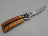 a knife with a wooden handle on a table