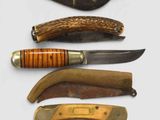 many different types of knives on a white surface