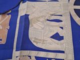 a blue table cloth with a picture of a horse and carriage on it
