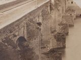 an old photo of a bridge over a river