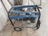 a blue machine that is sitting in the garage