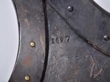 a close up of a metal object on a white surface
