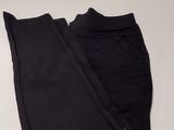 a pair of black pants sitting on top of a white table