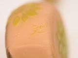 a close up of a bottle of liquid on a table