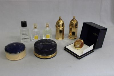a lot of perfume bottles and a box on a table