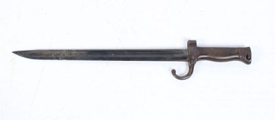 a close up of a knife on a white surface with a hook