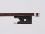 a close up of a violin bow on a white background