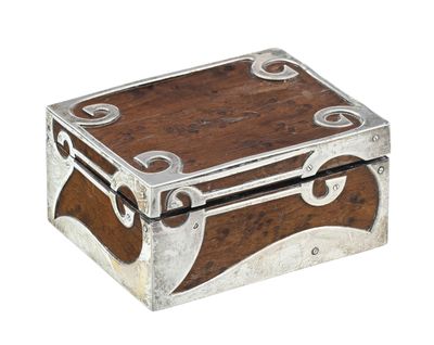 a small wooden box with metal accents on it