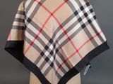 a beige and black checkered scarf on a mannequin mannequin mannequin mannequin mannequin mannequin mannequin manne