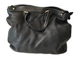 black leather handbag on white background with clipping for text