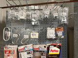 a picture of a pegboard with many items hanging on it