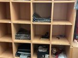 a wooden bookcase with many different items on it