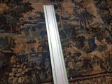 a picture of a ruler on a carpet with a picture of a forest