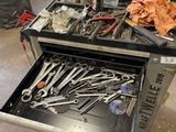 many tools in the drawer of a workbench